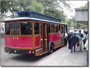 All aboard! The first passengers climb aboard one of the new trolley cars for destinations in downtown Baton Rouge.